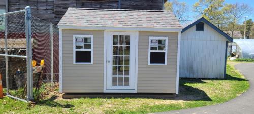 LI-8x12-Cape-tan-clapboard-colonial-slate-roof-framed-15-lite-door-2